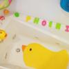 imageMunchkin Beak Bath Spout Cover Safety Guard with Builtin bubble bath dispenser YellowModern