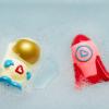 imageMunchkin Galaxy Buddies Water Safe Light Up Baby and Toddler Bath Toy Astronaut ampamp Rocket Ship