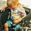 imageMunchkin Collapsible Wagon for Kids Foldable UltraCompact and Lightweight Stroller Wagon AllTerrain Wheels Adjustable Sun Canopy  Holds Up to 2 Passengers Black
